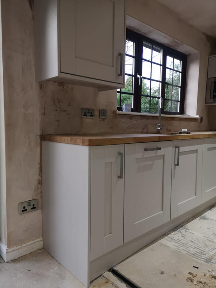 Mid-build kitchen showing socket placement and trunking route