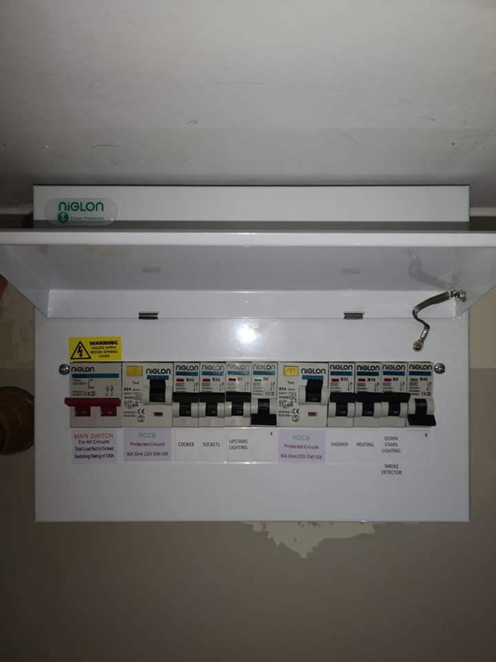 Consumer unit open showing neatly wired circuits