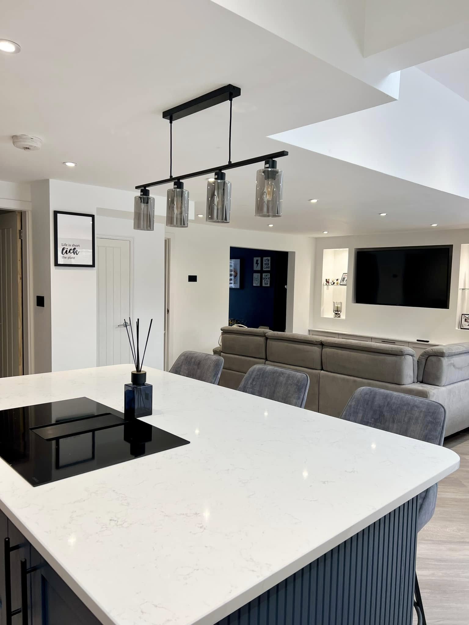 Open plan kitchen with LED downlights and skylight