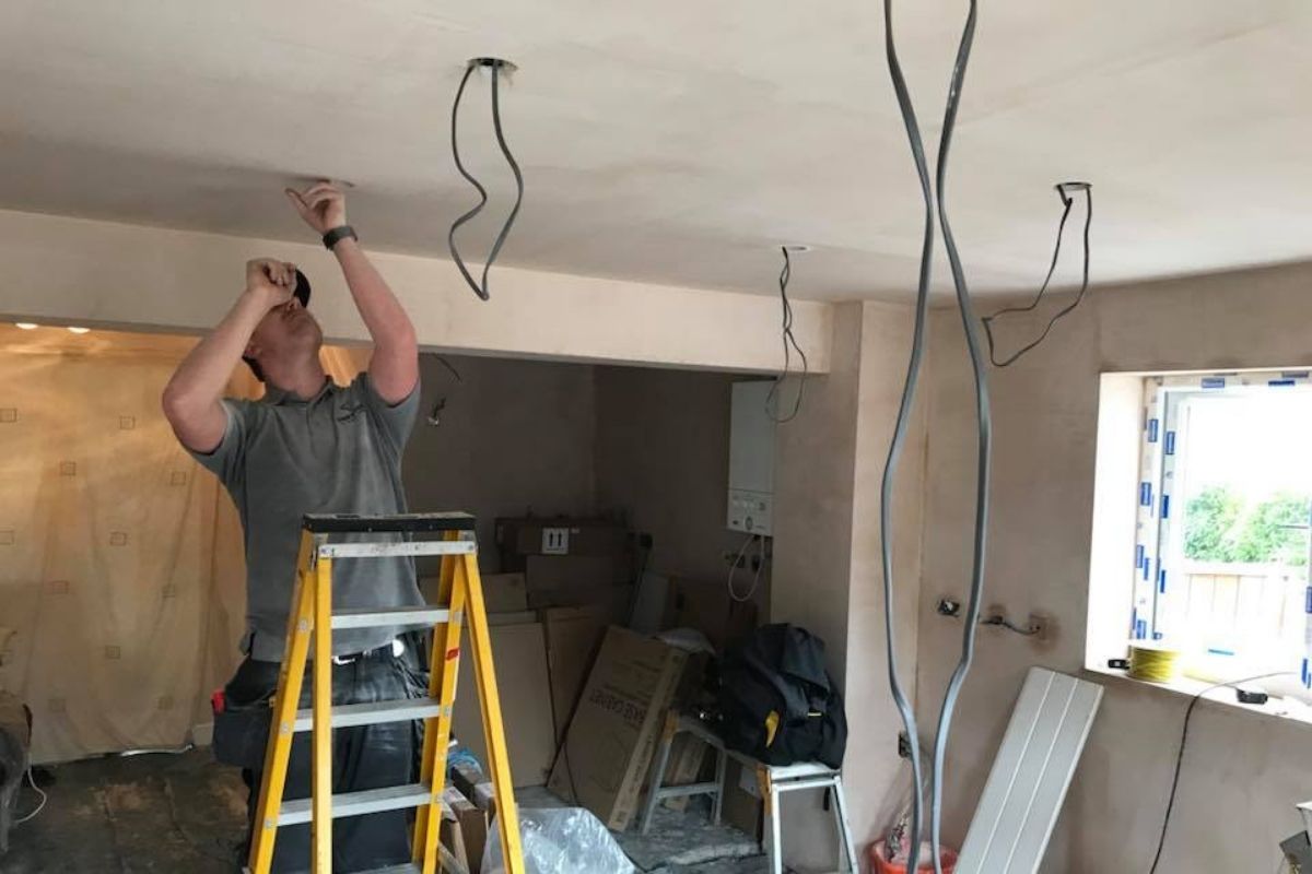 Matrix FSE electrician rewiring a property ceiling installation